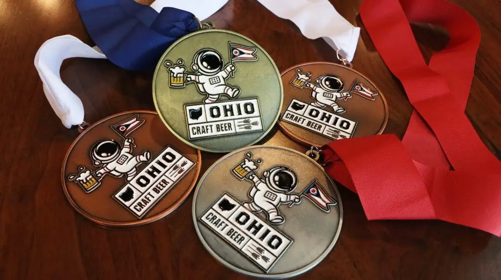 Four craft beer medals displayed