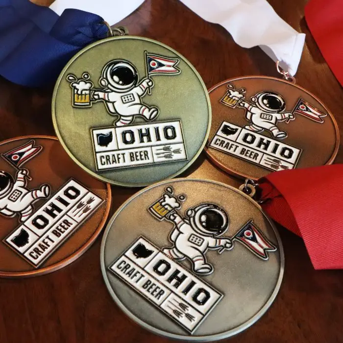 Four craft beer medals displayed