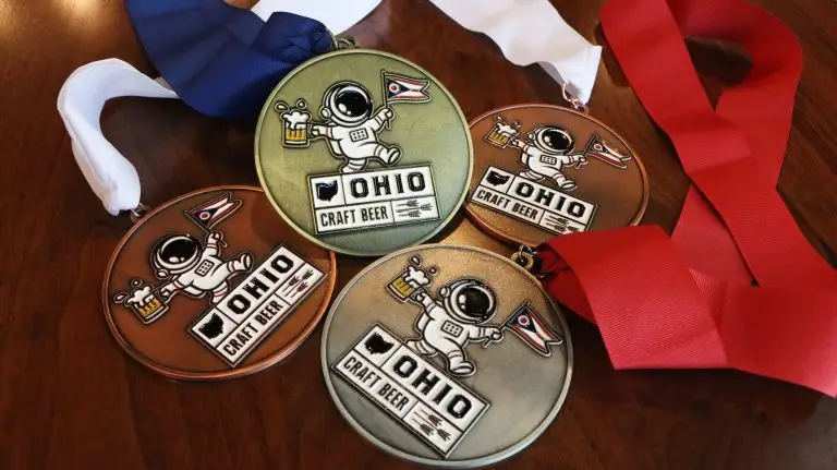 Four craft beer medals displayed
